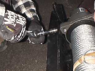 Tighten the winch down to the mounting plate.