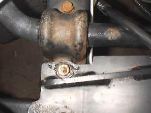 Tighten the rear bolts holding the winch in place.