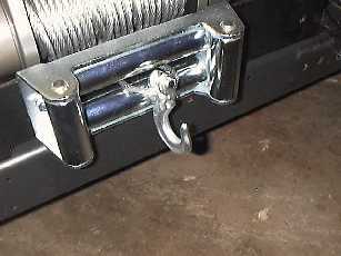 Pull the cable through and hook up the hook.