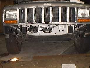 remove bumper and vacuum canister.